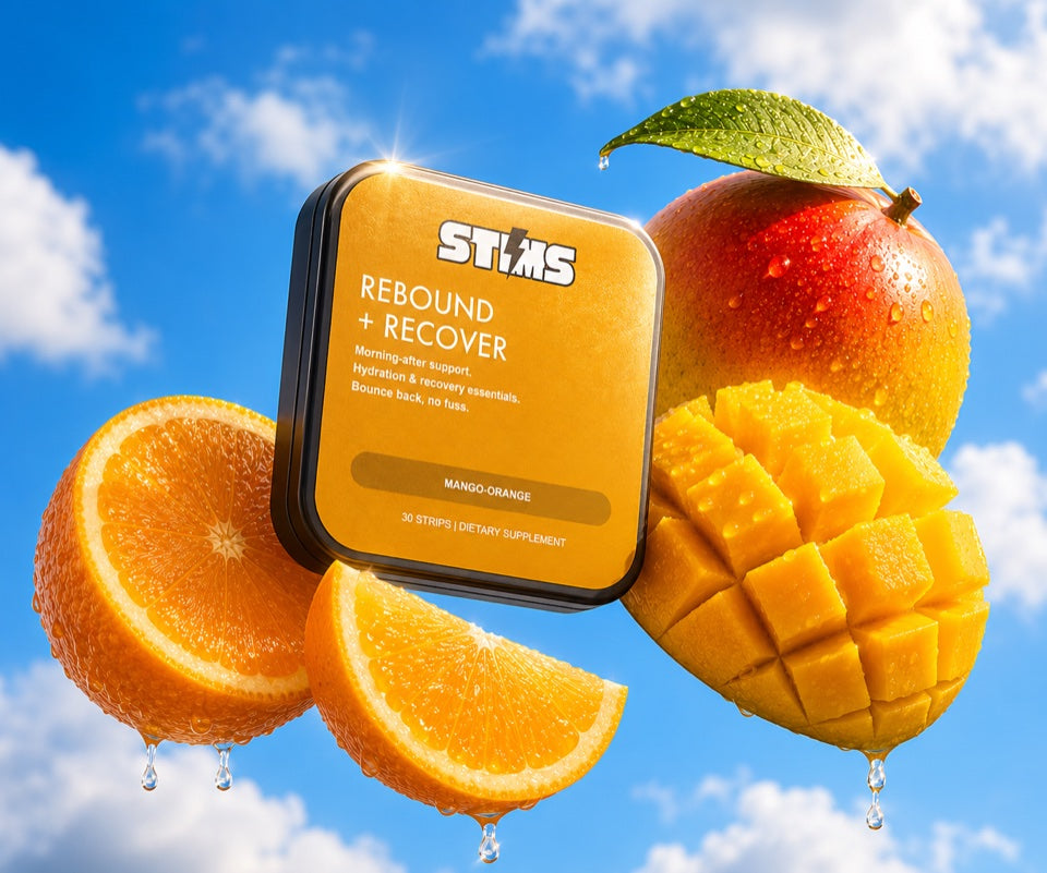 STIMS Rebound + Recover mango-orange recovery strips on a bed of mangoes and oranges